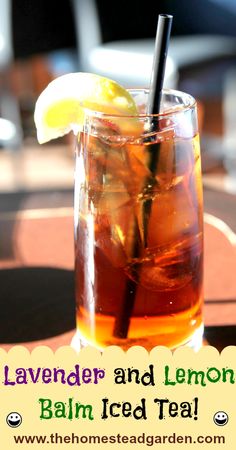 a glass filled with ice and lemon on top of a table