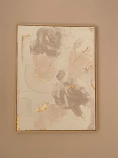 an abstract painting on the wall with gold leaf and flower shapes in white, beige and grey colors