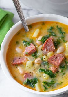 a close up of a bowl of soup on a table