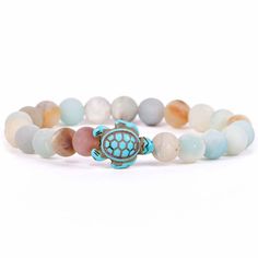 Give friends and family meaningful jewelry with a mission. This bracelet from Fahlo is enhanced with an assigned real sea turtle to track online. A portion of all proceeds is donated to the Sea Turtle Conservancy. Help save the sea turtles with a beautiful sky stone beaded bracelet with sea turtle charm and learn your turtle's name, size and get their picture. Each bracelet comes with a different real wild animal to track on your phone, tablet or computer. | Stretch bracelet features turtle and Tracking Bracelet, Save The Sea Turtles, Sea Turtle Bracelet, Summer Beach Jewelry, Save Wildlife, Gain Knowledge, Turtle Bracelet, Small Bracelets, Turtle Charm