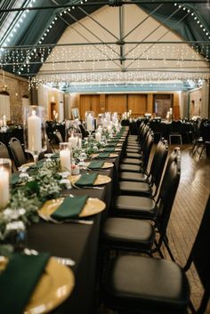 the tables are set up with candles and place settings for an elegant dinner or reception