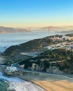 an aerial view of the golden gate bridge in san francisco, california with ocean and city below