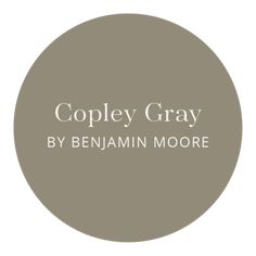 the words, copy gray by benamin moore are in white letters on a brown circle