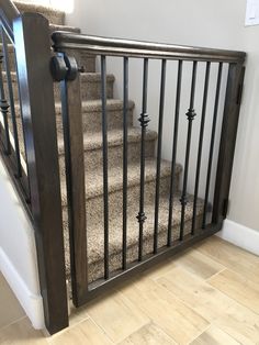 a stair railing is installed on the side of a set of stairs