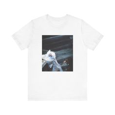 a white t - shirt with an image of a woman holding a bird on it