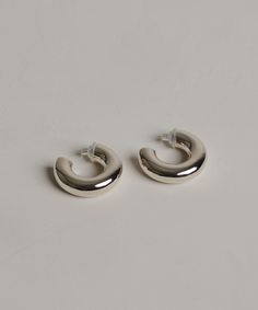 Small Donut Hoops SilverSophie Buhai is a designer living and working in Los Angeles. Her namesake jewelry collection, established in 2005, has renewed the modernist tradition of solid sterling silver with an emphasis on sculptural silhouettes. Sterling silver. Made in USA. Please note that this item is not eligible for promotions. | Sophie Buhai Small Donut Hoops Designer Living, Sophie Buhai, Cardigan Sweater Coat, Heel Slippers, Kids Sweater, Cool Socks, Long Sleeve Shirt Dress, Sunglasses Shop, Emphasis