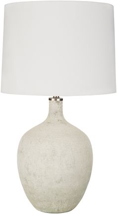 a white table lamp with a white shade on it