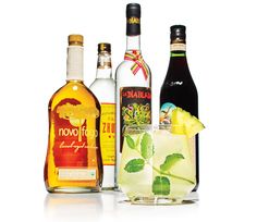 several different types of alcoholic beverages on a white background