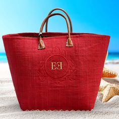 This elegant beach bag is made by Le Comptoir De LA Plage -  Franch well known company since 1999 - entirely made by hand in Madagascar, from Raffia, with leather handles. You can choose 1 of 4 frames (see picture 2). Dual carrying handles 19"W x 12.5"H x 6"D Flat base Accent stitching on bottom Entirely hand made from natural fibers 100%  Authentic  Personalized by request with Monogram or Name Colors available: - natural with green border -natural with red border - pink - red - yellow - turquo Red Beach Bag With Double Handle, Red Straw Tote Bag For Shopping, Red Bohemian Straw Bag For Summer Travel, Red Rectangular Beach Bag With Large Capacity, Red Tote Straw Bag For Shopping, Red Straw Bag With Double Handle For Daily Use, Red Double Handle Beach Bag For Shopping, Red Double Handle Beach Bag For Travel, Red Large Capacity Beach Bag For Vacation