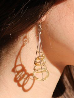 Cornucopia - Prosperity Design - Greek Gold Abstract Perpetual motion Geometric Earrings - Greek Mythology art Jewelry - mythical amulet - by Palsar - Maria Skandalaki Jewelry inspired by "Cornucopia". Cornucopia... also called the horn of plenty, was a symbol of abundance and nourishment, commonly a large horn-shaped container overflowing with produce, flowers, or nuts. In Greek mythology, the horn of goat Amalthea, is the symbol of human prosperity and bliss. The eternal symbol of abundance of Contemporary Sterling Silver Hoop Jewelry, Fusion Style Sterling Silver Hoop Earrings As Gift, Silver Spiral Fine Jewelry, Contemporary Handmade Teardrop Jewelry, Pierced Fusion Style Sterling Silver Jewelry, Unique Spiral Yellow Gold Jewelry, Formal Spiral-shaped Jewelry With Matching Earrings, Sterling Silver Spiral Earrings For Formal Occasions, Formal Spiral Jewelry With Matching Earrings