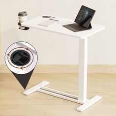 a laptop computer sitting on top of a white desk