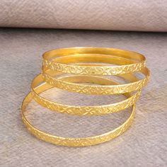 Gold brass bangles, Gold Bangles, Flower Design Bangles, Gift for Her, Bridesmaid gift, Stackable Bangles, Anniversary Gift, Women Gift item Metal- Brass ✦ Our products are made of high-quality Brass metal and are carefully crafted by hand in our family workshop. The brass metal will develop a nice antique color over time. So, I suggest cleaning it once in a while for getting back to the shiny original color. You can use natural ingredients like lemon or vinegar with water to clean it. Also, app Cheap Stackable Wedding Bangle, Wedding Brass Bracelets Round Shape, Gold Bangle Bracelet For Bridesmaids, Gold Round Bracelets For Bridesmaid, Bangles Gold, Stackable Bangles, Transparent Nails, Brass Bangle, Gold Brass