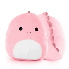 a pink stuffed animal with black eyes