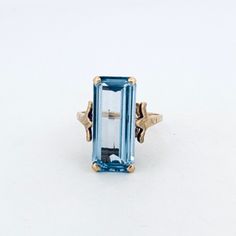 "Vintage Estate 14k Yellow Gold Large Rectangle Blue Spinel Statement Ring, Size 7.5, 6.2g" Description: "Make A Bold Statement With This Exquisite Vintage Estate Piece - A 14k Yellow Gold Large Rectangle Blue Spinel Statement Ring, Sized Perfectly At 7.5. Crafted With Impeccable Attention To Detail, This Stunning Ring Features A Striking Blue Spinel Stone Securely Held In Place By Four Prongs, Radiating Elegance And Sophistication. The Hallmark May Be Worn, But Rest Assured, We've Conducted Tho Rectangular Yellow Gold Sapphire Ring For Formal Occasions, Rectangular Topaz Ring In Yellow Gold, Yellow Gold Rectangular Sapphire Ring For Formal Events, Formal Yellow Gold Topaz Ring With Rectangular Stone, Formal Rectangular Sapphire Ring In Yellow Gold, Formal Yellow Gold Sapphire Ring With Rectangular Shape, Classic Blue Octagon Topaz Ring, Blue Topaz Baguette Cut Ring In 14k Gold, Formal Rectangular Sapphire Ring Fine Jewelry