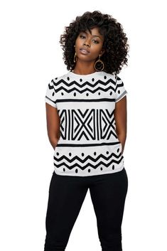 Introducing our African Zigzag Print Women T-shirt - a unique and stylish addition to your wardrobe. Made with high-quality fabric, this shirt boasts a chic zigzag print that adds an eye-catching touch to any outfit. Embrace the beauty of African design and elevate your fashion game with this must-have piece. Product Features Please Compare your Measurements To our Size Chart This T-shirt is Designed for fashionable women. Made from 5.47 Oz. 100% polyester. Double-needle hemmed sleeves and botto Trendy Short Sleeve Tops With Abstract Print, Trendy Cotton Tops With Abstract Print, White Casual Tops With Abstract Print, White Casual Top With Abstract Print, Casual White Tops With Abstract Print, Short Sleeve Graphic Tee With Abstract Print, White Geometric Pattern Crew Neck Top, Black Cotton Tops With Geometric Pattern, Casual Geometric Graphic Print Tops