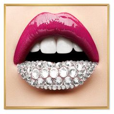 a woman's lips with shiny jewels on the lip and white teeth in front of her