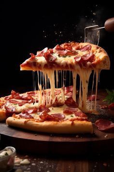 a person is taking a slice of pizza with cheese and pepperoni on the table