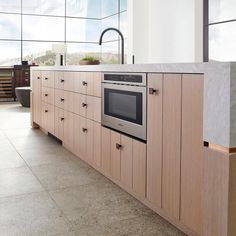 a kitchen with an oven, sink and counter tops in it's center island