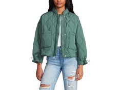 Steve Madden Stefani Jacket - Women's Clothing : Deep Green : Get the casual piece for layering on fall by adding Steve Madden Stefani Jacket. Relaxed fit. Mock neck. Zip-snap front closure. Cinch long sleeves. Patch pockets. Quilted lightweight nylon jacket. 100% polyester. Hand wash cold separately, do not bleach, lay flat to dry, low iron if necessary, or dry clean. Imported. Casual Spring Puffer Windbreaker, Quilted Jacket With Stand Collar For Fall, Fall Quilted Jacket With Stand Collar And Pockets, Versatile Winter Windbreaker With Pockets, Fall Puffer Jacket With Pockets Long Sleeve, Green Long Sleeve Puffer Jacket For Fall, Fall Long Sleeve Puffer Jacket With Pockets, Spring Puffer Windbreaker With Long Sleeves, Spring Long Sleeve Puffer Windbreaker