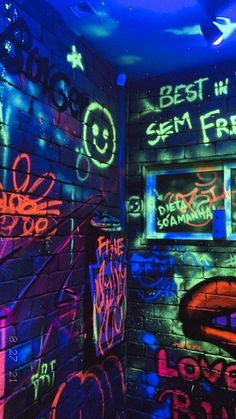 graffiti is painted on the walls and ceiling in a room with brick walls, blue lighting, and neon lights