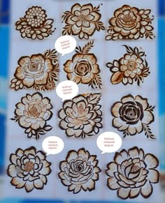 several different types of flower designs on a white board with brown and black flowers in the middle