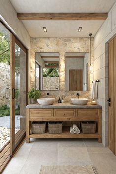 a large bathroom with two sinks and mirrors