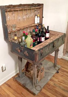 an old trunk filled with bottles and glasses