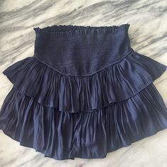 Navy Skirt Never Worn Super Cute With White Bodysuit!! Blue Tiered Mini Skirt With Elastic Waistband, Chic Blue Skirt With Elastic Waistband, Blue High Waist Mini Skirt For Vacation, Blue High Waist Ruffled Skort, High Waist Blue Ruffled Skort, Blue High-waist Ruffles Skort, High-waist Blue Skort With Ruffles, Blue Mini Skirt With Elastic Waistband For Day Out, Chic Blue Mini Skirt With Elastic Waistband