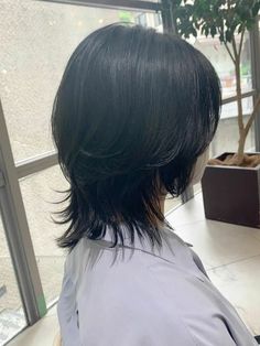 the back of a woman's head with black hair