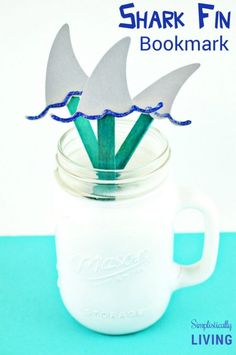 shark fin bookmarks in a mason jar with text overlay that reads shark fin bookmark