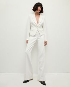 Our best-selling Tonelli pant, reimagined. We updated the wide-leg pant with chic tuxedo stripes on the side. Everything else you love about the style remains the same—the precision tailoring, relaxed fit and clean, flat-front silhouette. Dress it down with a simple tee or sweater or go for a power suit with a black jacket and printed blouse.63% Polyester, 27% Viscose, 7% Cotton, 3% ElastaneLining: 100% PolyesterMade in USADry clean onlyStyle #2410SU0026291 White Fitted Double-breasted Blazer, Tailored White Double-breasted Outerwear, Veronica Beard Miller Dickey Jacket, Veronica Beard Miller Jacket, White Veronica, Veronica Beard Dickey Jacket, Silhouette Dress, Denim Hat, Power Suit