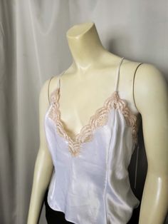 15% OFF  WAS $26.00   NOW $22.00 Brand: VAL MODE Lingerie. Made in the USA from imported fabric. Beautiful luxurious white silky satin camisole top. Decorated with two-tone champagne color lace. Spaghetti straps. 100% Polyester Size: L Bust: 19"  Length: 10" (under arm to hem) Perfect condition. NWT Thank you for visiting my store. You can also visit my MargaretJewelryShop or http://jewelryandclothing.net/ Please read "The Private Policy" Satin Camisole, Lace Decor, Satin Top, Champagne Color, Night Gown, Two Tone, Favorite Outfit, Spaghetti Strap, Camisole Top