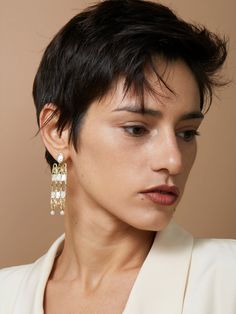 Make an elegant and bold statement in these large chandelier style earrings. Crafted in the ancient filigree method where gold wires are arranged into patterns and fused together to create lightweight frames. These earrings feature hand cut mother of pearl windows and 4.3 mm freshwater pearls.• Available in 14 karat recycled yellow gold• 69 mm long / 18 mm wide• Post back, large butterfly clasp Learn more about our sustainability practices here. All of our pieces are hand-crafted in our Brooklyn 3/4 Profile, Shortish Hair, Large Chandelier, Really Short Hair, Face Drawing Reference, Female Pose Reference, Haircut Inspiration, 90s Hairstyles, Body Reference Poses