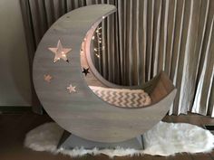 the moon shaped bed has stars on it