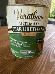 a paint can sitting on top of a wooden table