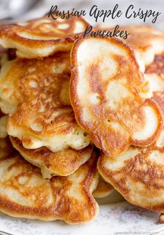 some pancakes are stacked on a plate and ready to be eaten