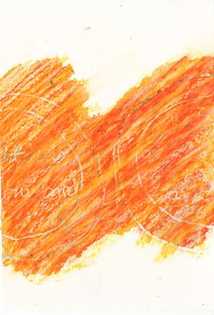 an orange piece of paper that has been drawn with colored crayons on it