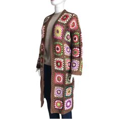 Embrace bohemian charm with our Granny Square Long Cardigan, a versatile piece perfect for any wardrobe. This handmade crochet duster cardigan is a delightful blend of vintage-inspired patchwork and contemporary style, making it an ideal gift for women and men alike. Design: Intricate sunburst granny square pattern Length: Long duster style for added elegance Material: Soft, breathable cotton for year-round comfort Fit: Unisex design suitable for both women and men Style: Perfect for festivals, Long Patchwork Cardigan For Layering, Bohemian Granny Square Sweater, One Size, Handmade Bohemian Spring Cardigan, Bohemian Crochet Cardigan One Size, One Size Bohemian Crochet Cardigan, Handmade Bohemian Cardigan For Fall, One Size Bohemian Sweater, Bohemian Handmade Fall Cardigan, Festival Long Cardigan One Size