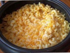 a crock pot filled with macaroni and cheese