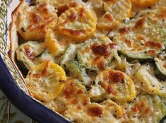 a casserole dish with zucchini and squash