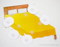 an image of a bed made out of cutout paper with circles on the top