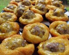 there are many small pastries on the plate with blue and white checkered cloth