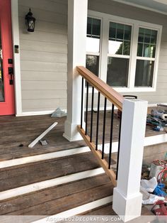 the front porch is covered with trash and other things to put on it's deck