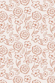 an orange and white flower pattern on a light colored background with small flowers in the center