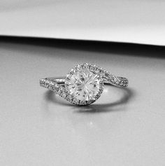 a diamond ring on top of a table