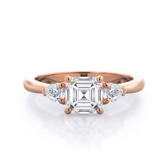 an engagement ring with three stones on the side