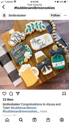 a wooden table topped with lots of decorated cookies