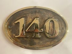 a metal plaque with the number forty four on it