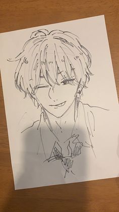 a drawing of an anime character on paper