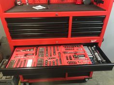 a red toolbox filled with lots of tools